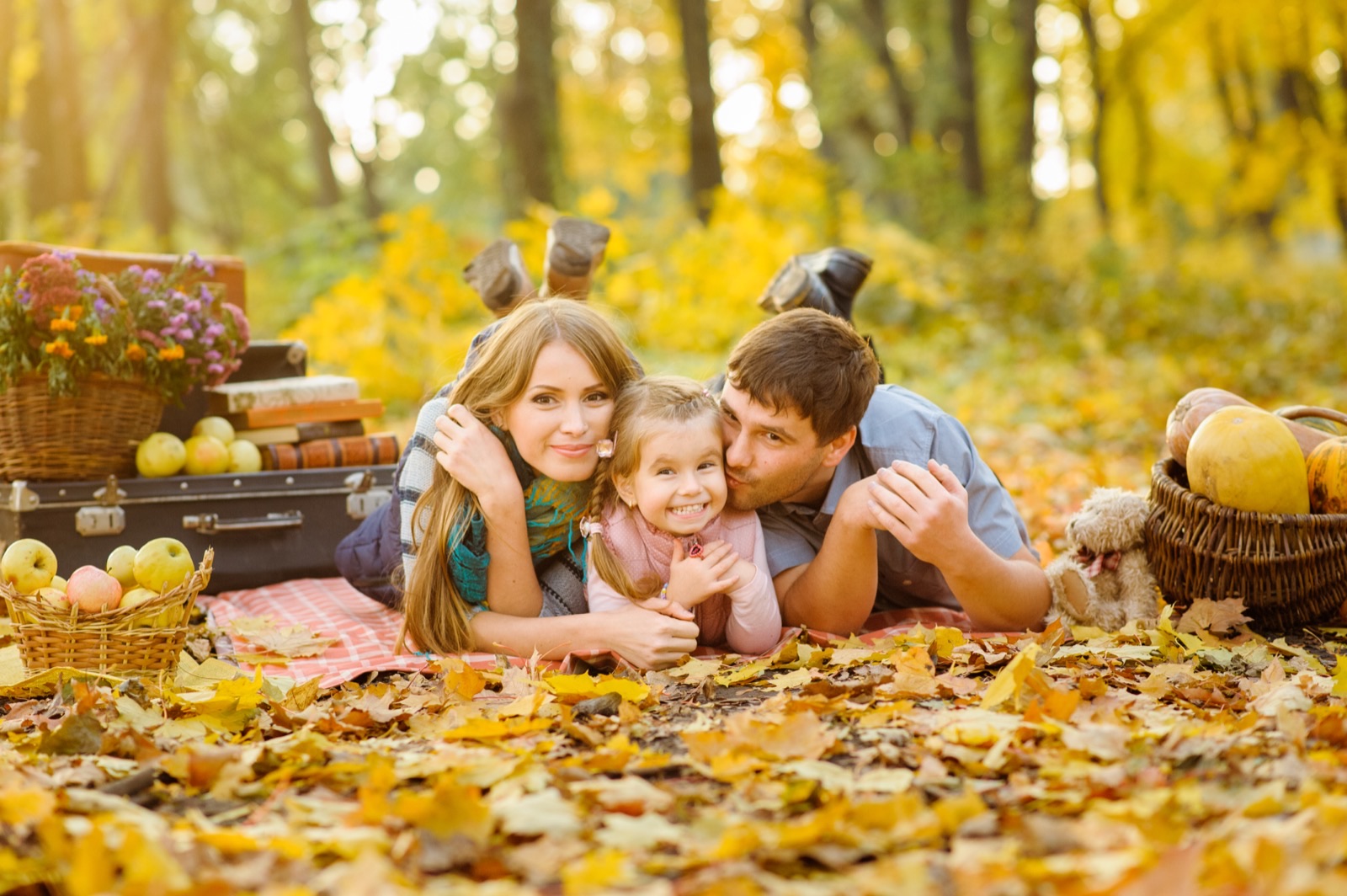 A family together among the autumn leaves
